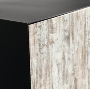 Closeup details of modern tv stand made from walnut and powder coated steed, shallow focus